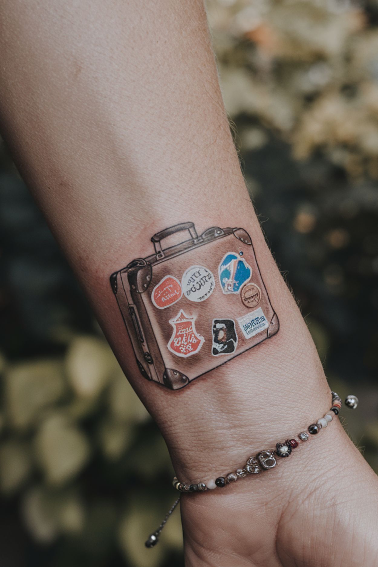 Small Suitcase Wrist Tattoo Ideas for Women 