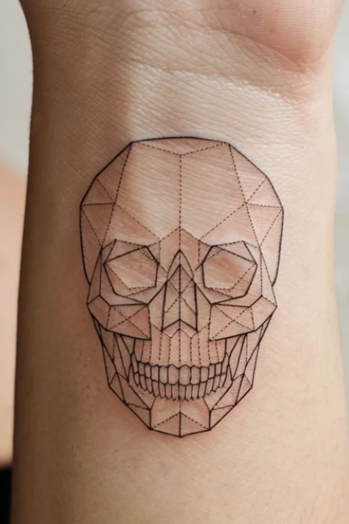 Small Skull Wrist Tattoo Ideas for Women
