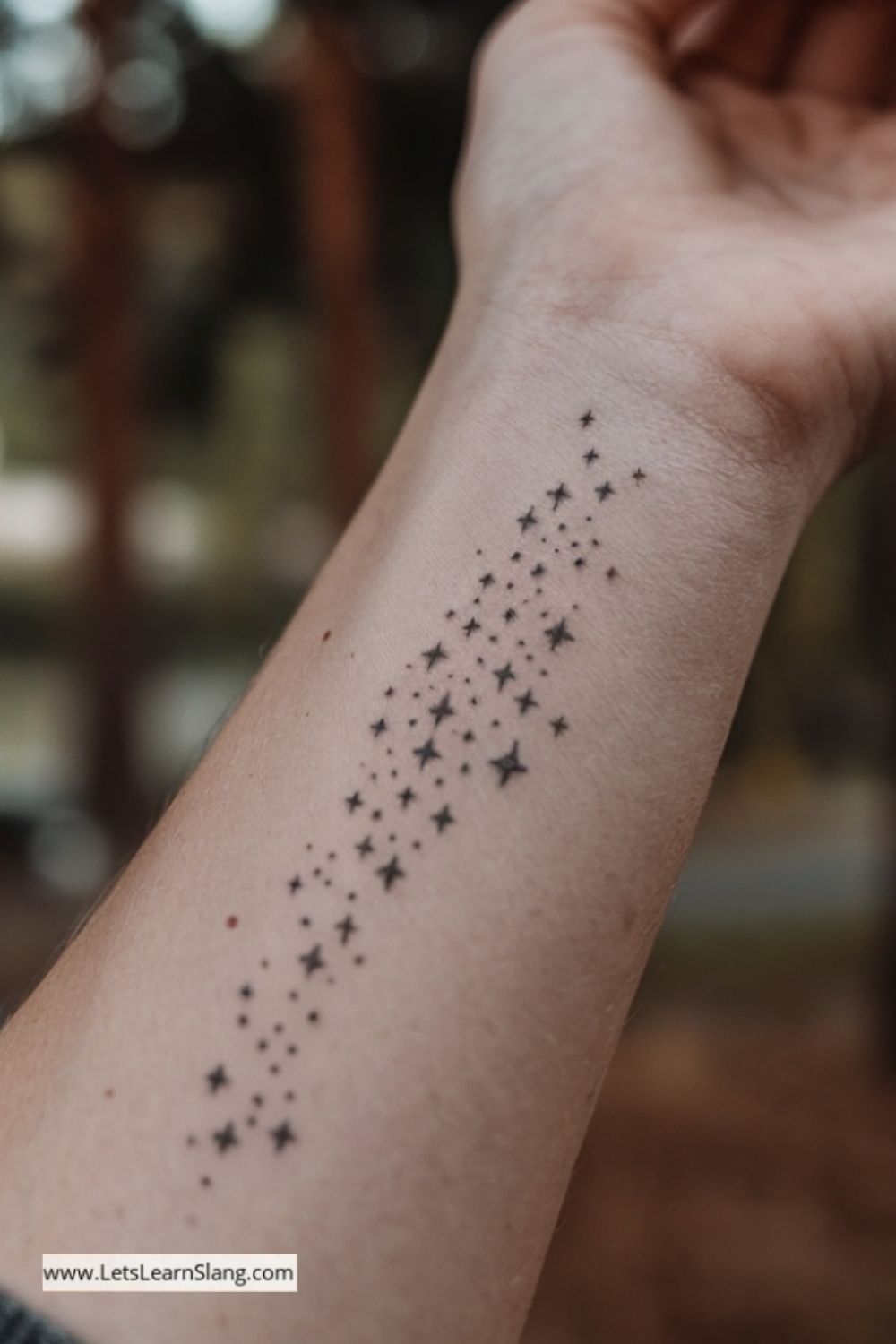 Scattered Stars Wrist Tattoo